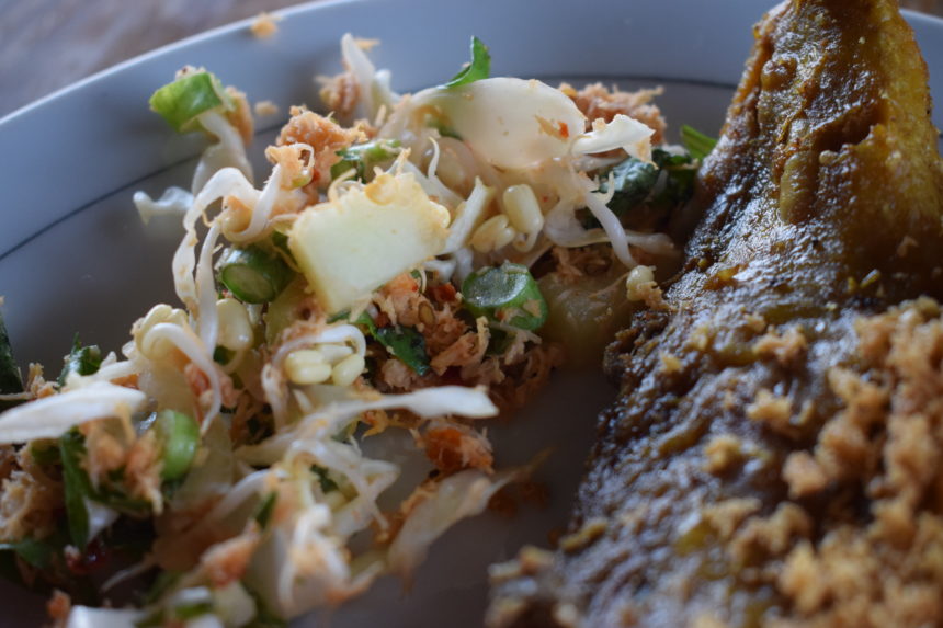 urap (Indonesian salad topped with fried coconut) served with bebek goreng 