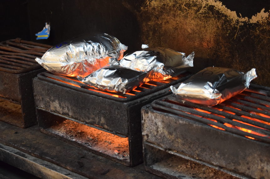 foil seafood parcels on charcoal grill