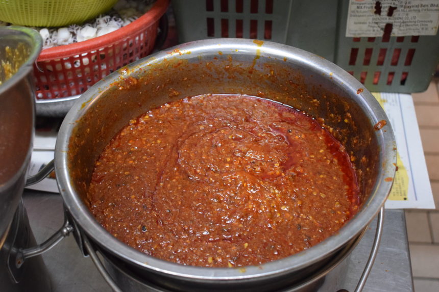 big pot of deep-red spicy sambal sauce