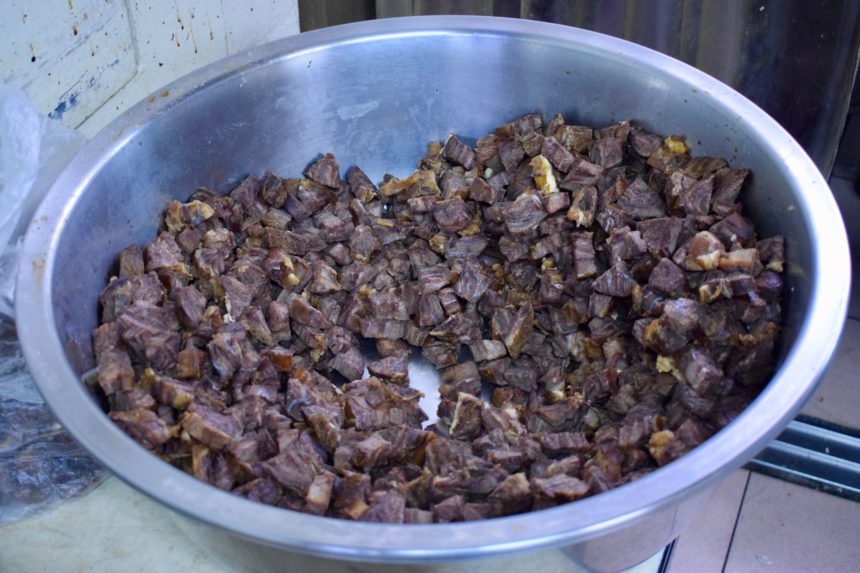 Large bowl of beef ready to go into soup at Fuhong Beef Noodle