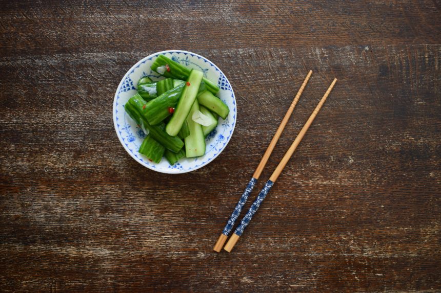 Taiwanese cucumber salad on table with chopsticks