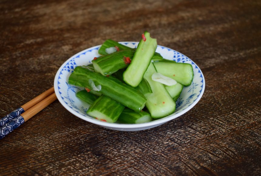 Taiwanese cucumber salad on table with chopsticks