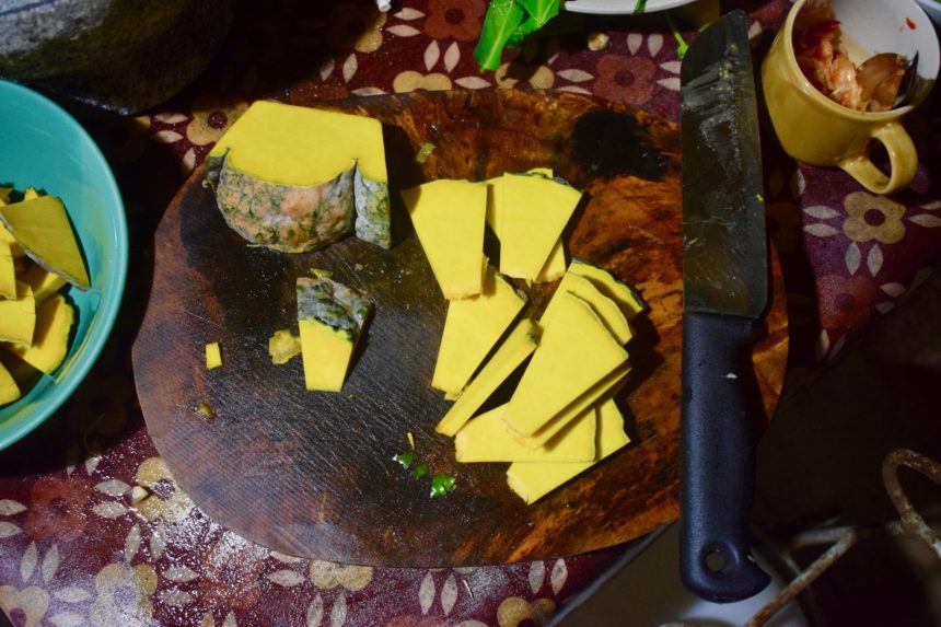 Thin slices of kombucha squash on chopping board ready to be stir fried