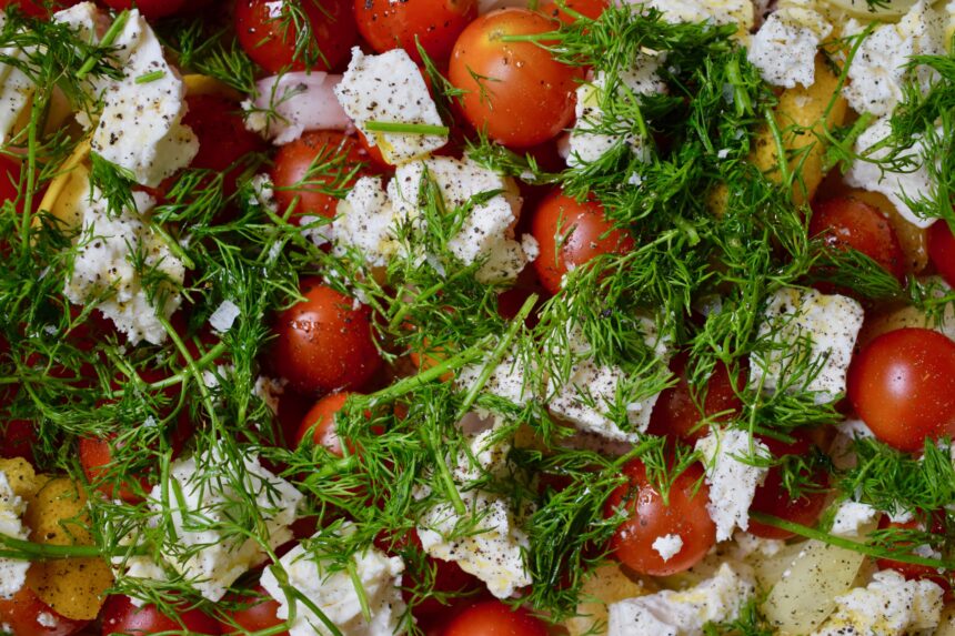 The raw ingredients for Greek Mediterranean rice before roasting covered with dill