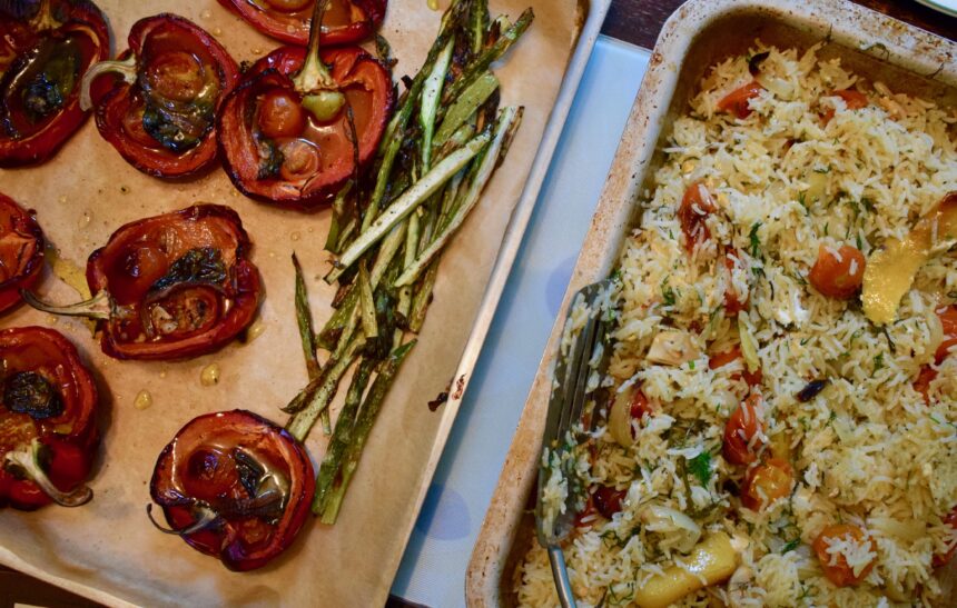 Mediterranean rice dish served with roasted peppers and asparagus